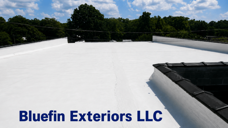 Completed white commercial roof coating by Bluefin Exteriors in Greensboro, Alabama