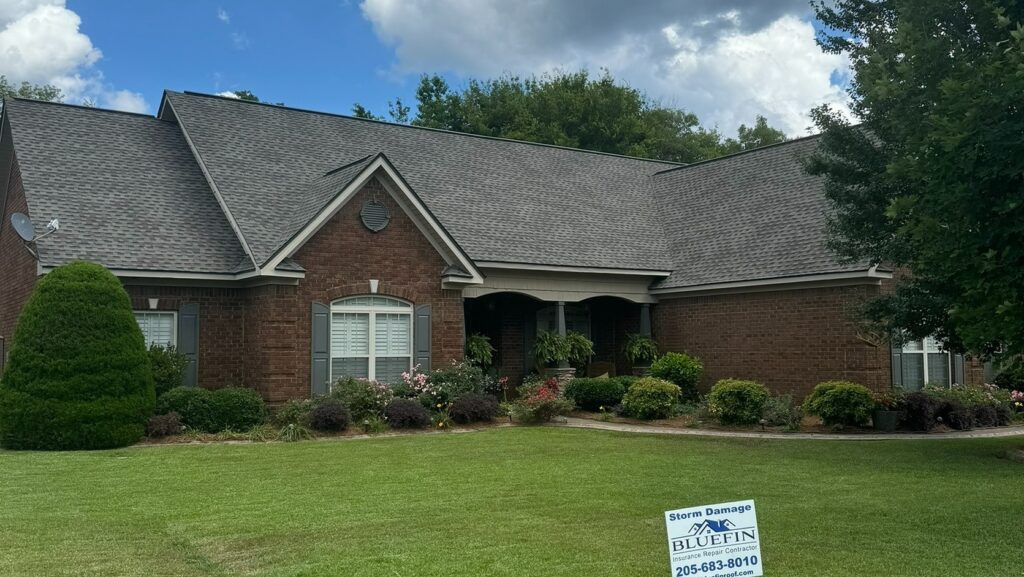 Completed hail damage roof replacement with laminated shingles in Moundville, Alabama, by Bluefin Exteriors